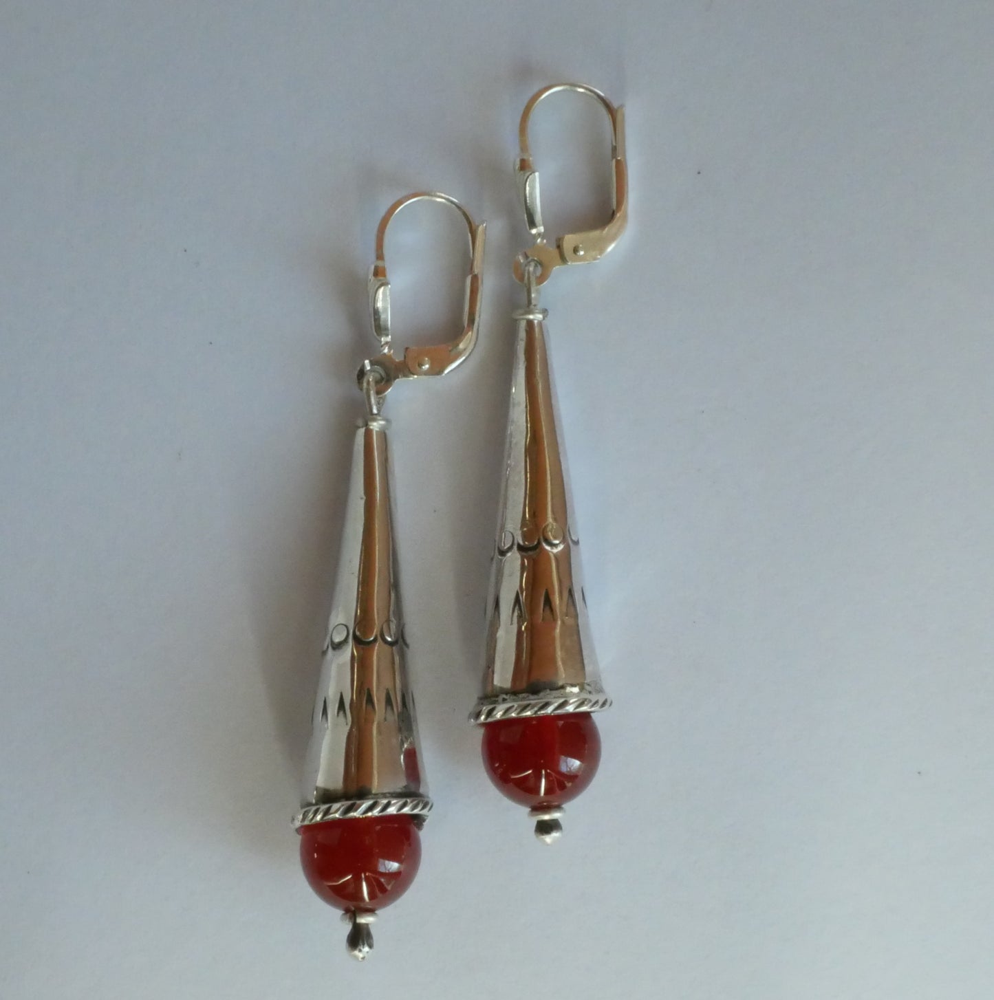 silver cone shaped earrings with carnelians
