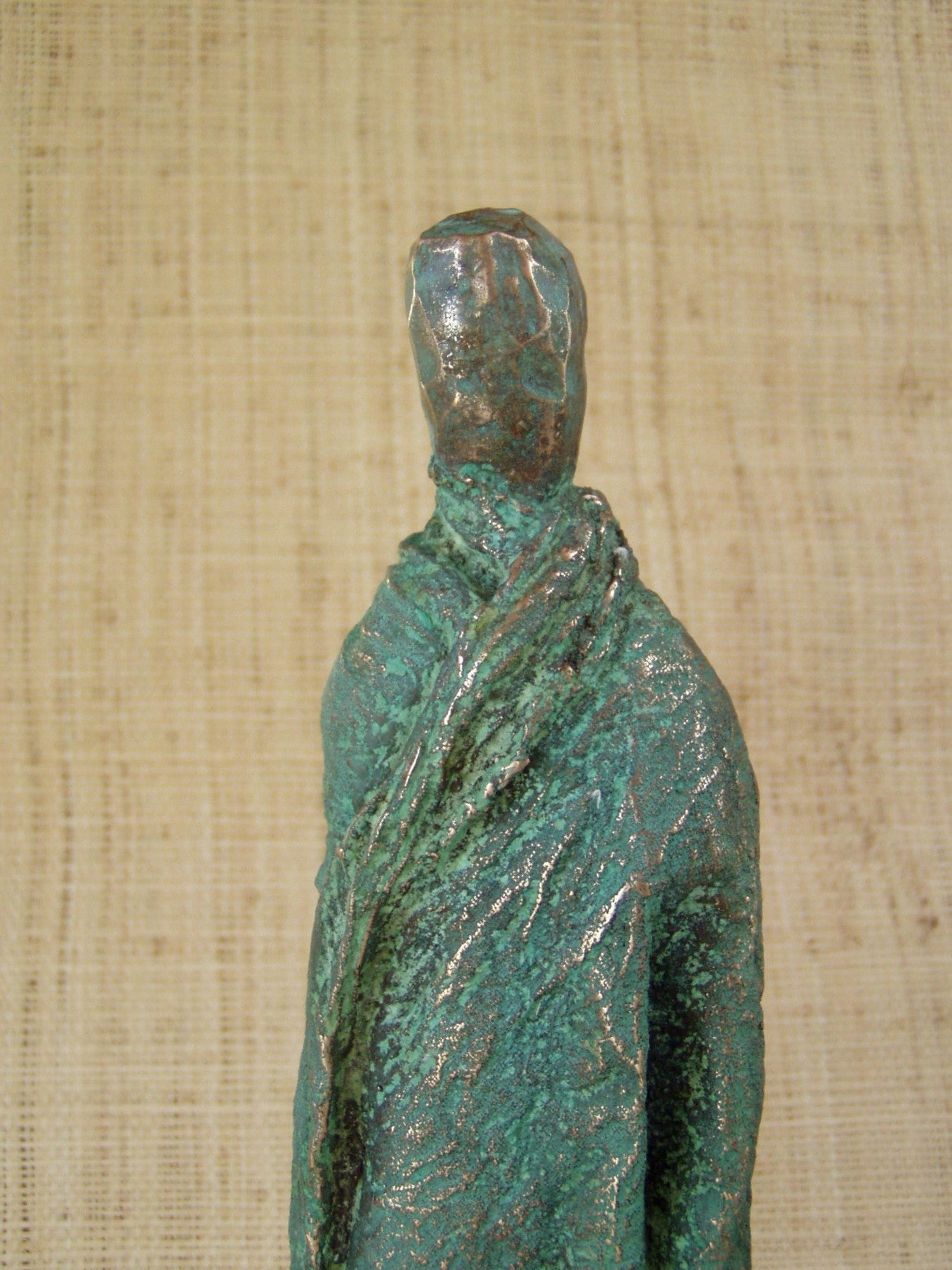 green weathered draped figure